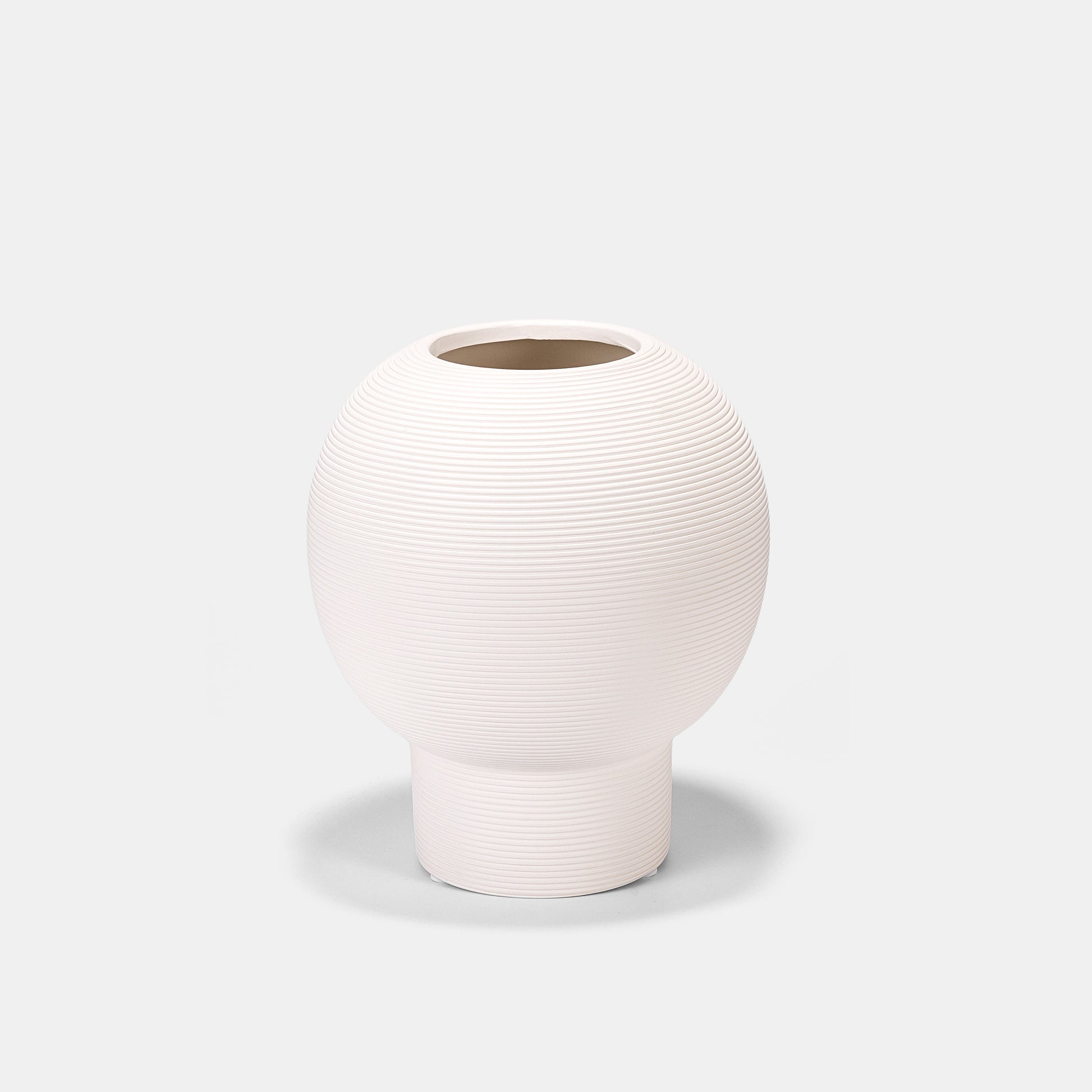 Artisanal pottery vase with crackle-glaze detailing. This white vase mimics antique ceramics, offering timeless charm. The ceramic vase’s wide mouth accommodates voluminous blooms as a white floral vase, while its curved silhouette adds vintage flair to farmhouse tablescapes.