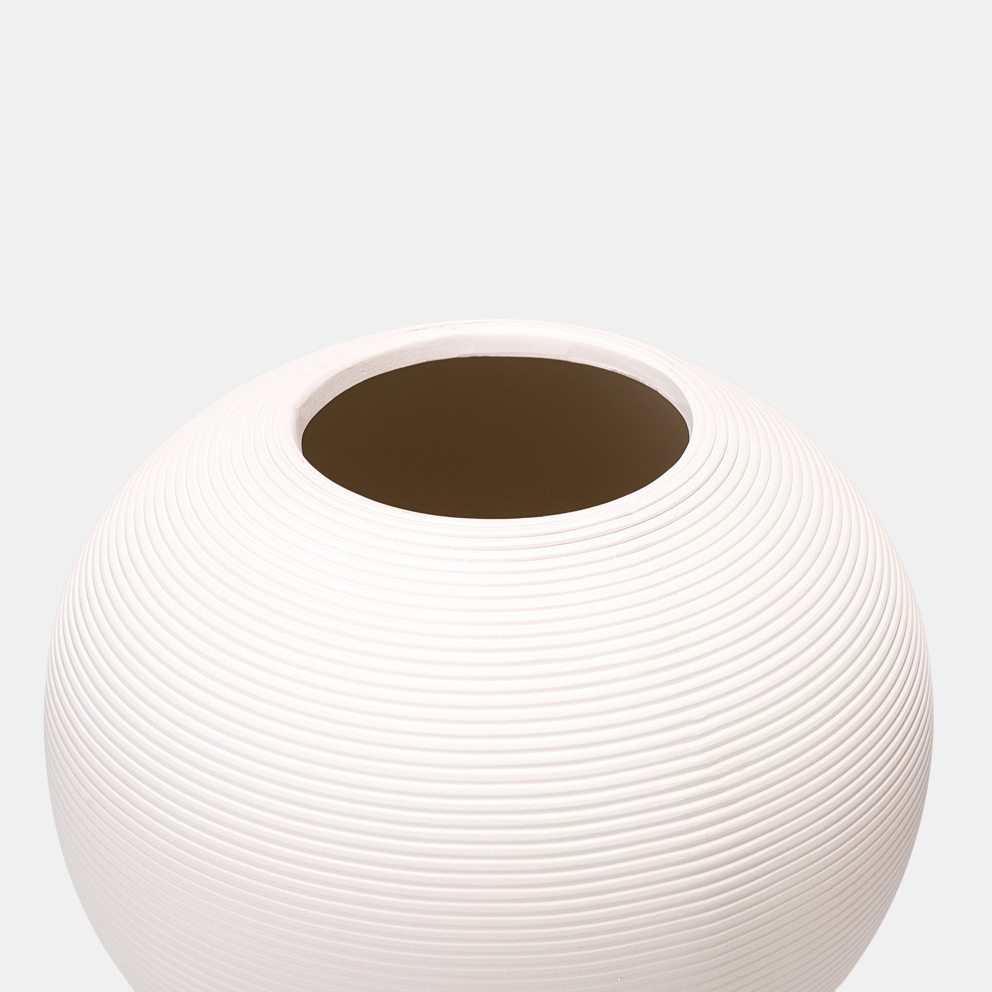 Eco-friendly white vase made from recycled clay. This sustainable ceramic vase features raw-edge pottery vase aesthetics with matte finish. The white floral vase’s irregular form celebrates imperfections, pairing perfectly with wildflower bouquets or pampas grass.