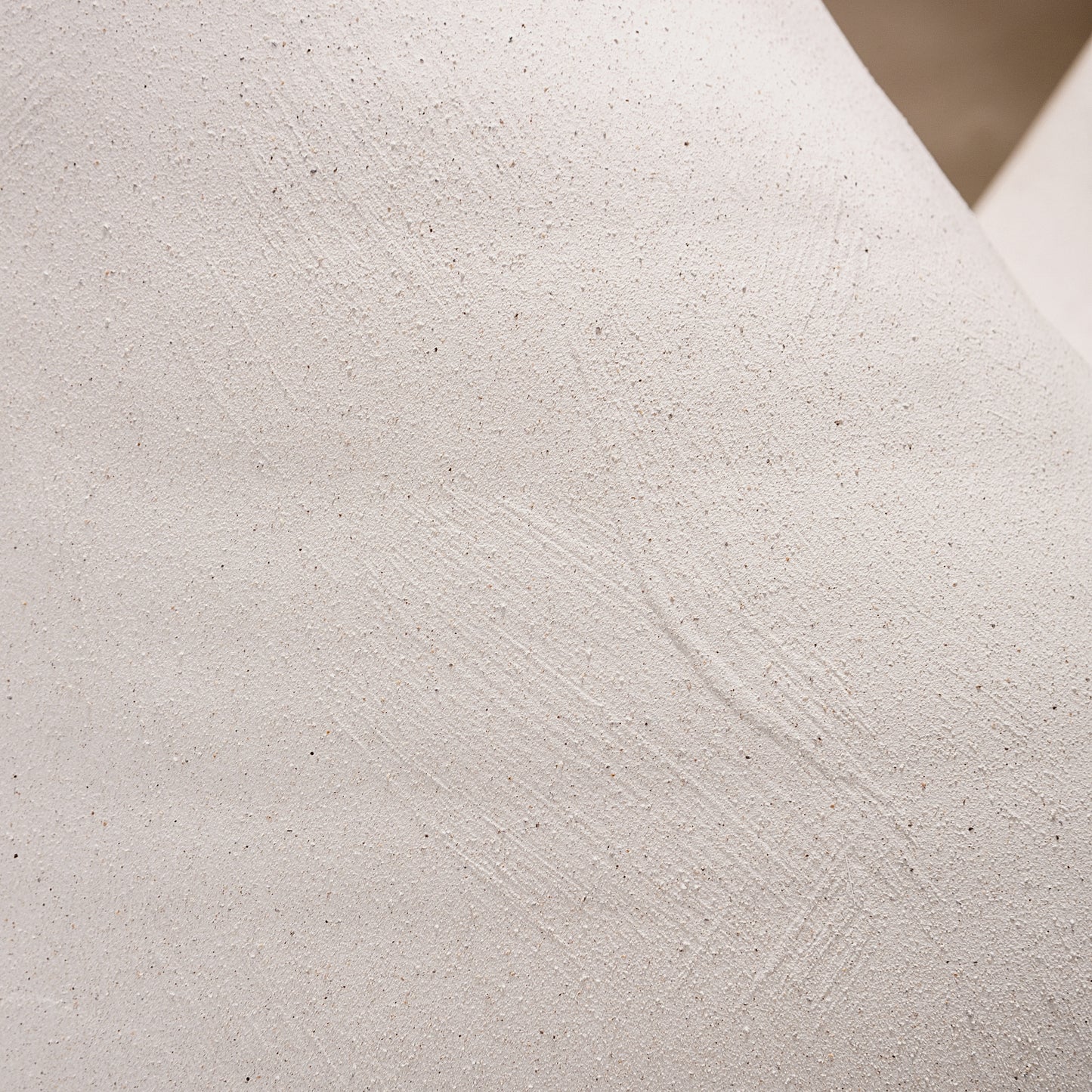 This large ceramic vase captivates with its ocean-inspired organic curves and sandy-textured matte finish. The white color vase’s generous size makes it ideal as a floor vase for bold floral arrangements or dried branches. Pair with bud vases for coastal-chic tablescapes.