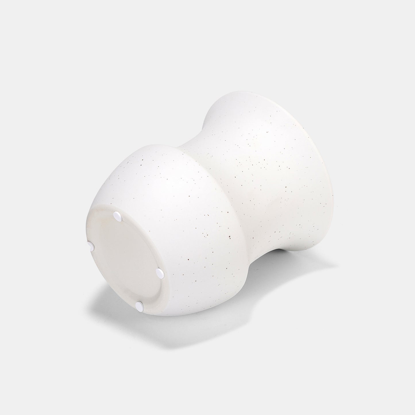 Crafted with vintage-inspired proportions, this white ceramic vase features a speckled texture that adds tactile depth. Use it solo for flowers on vase elegance or cluster with bud vases for dynamic displays. The white vase’s stabilized base securely holds tall stems, merging function and artistry.