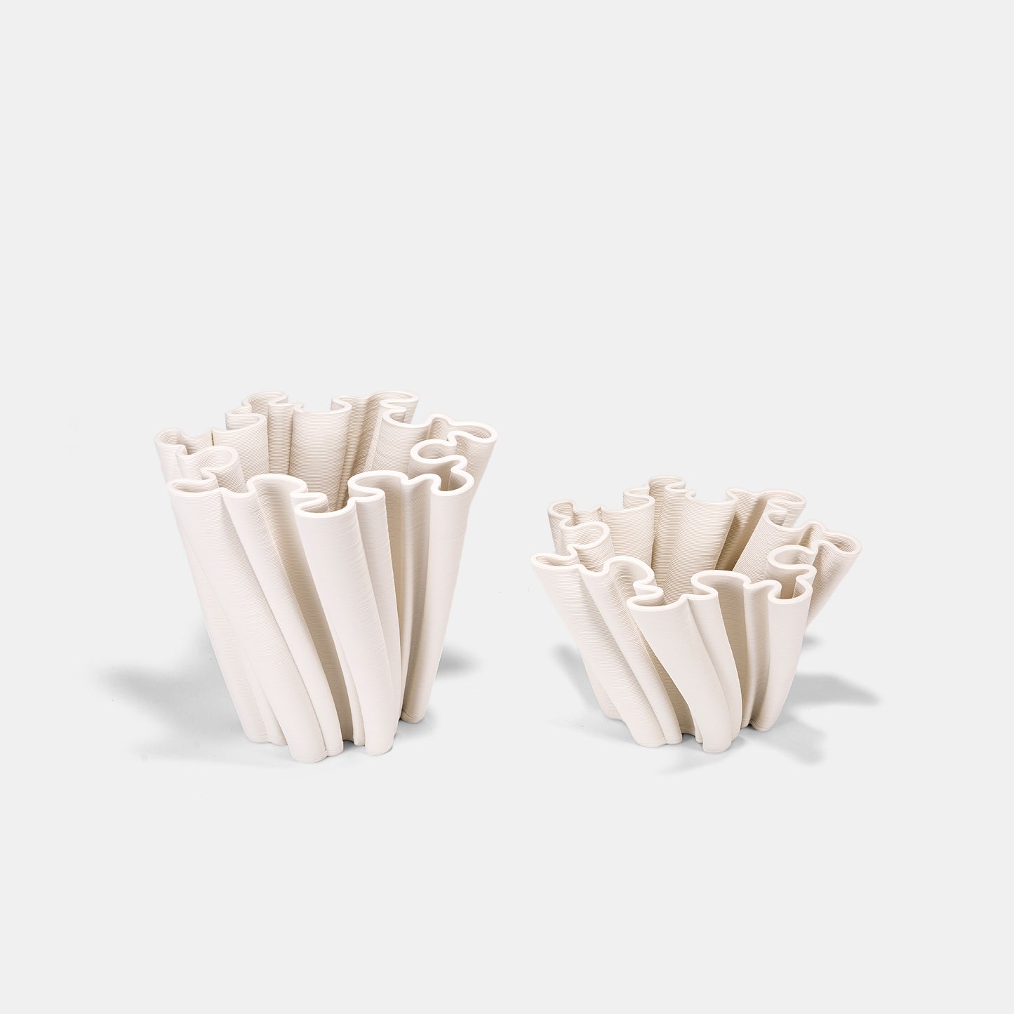 Intricate white ceramic vase with embossed botanical patterns. This large white vase combines art and utility – the textured white floral vase enhances rose arrangements while empty. The big white vase’s curved handles add functional elegance to its ceramic construction.
