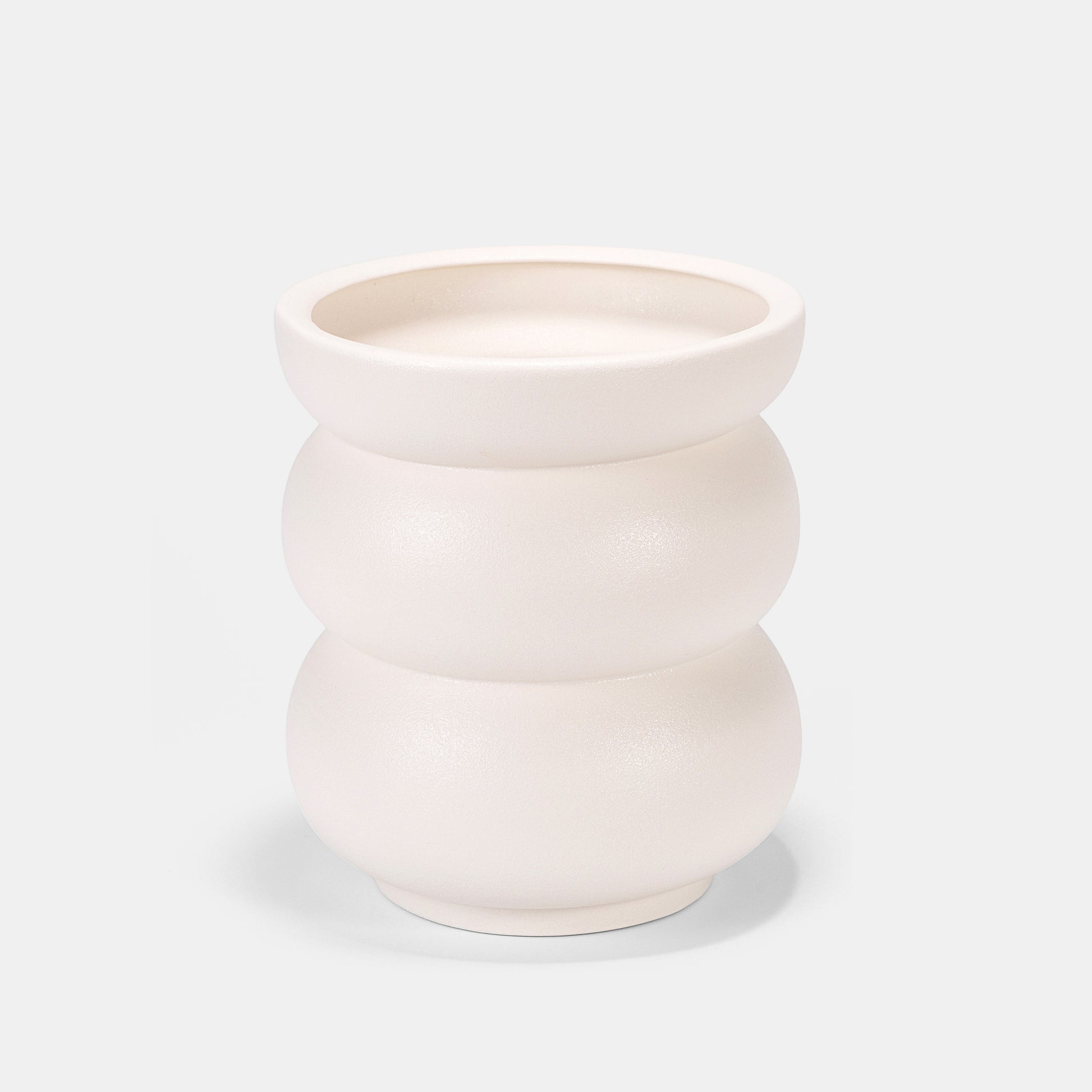 Artisanal white ceramic vase features organic, belly-like contours with a tactile matte finish. Holds peonies dramatically or stands solo as sculptural decor. Complements slender bud vases in yin-yang arrangements. Fits boho-chic to farmhouse styles—textured imperfections tell its handmade story. 