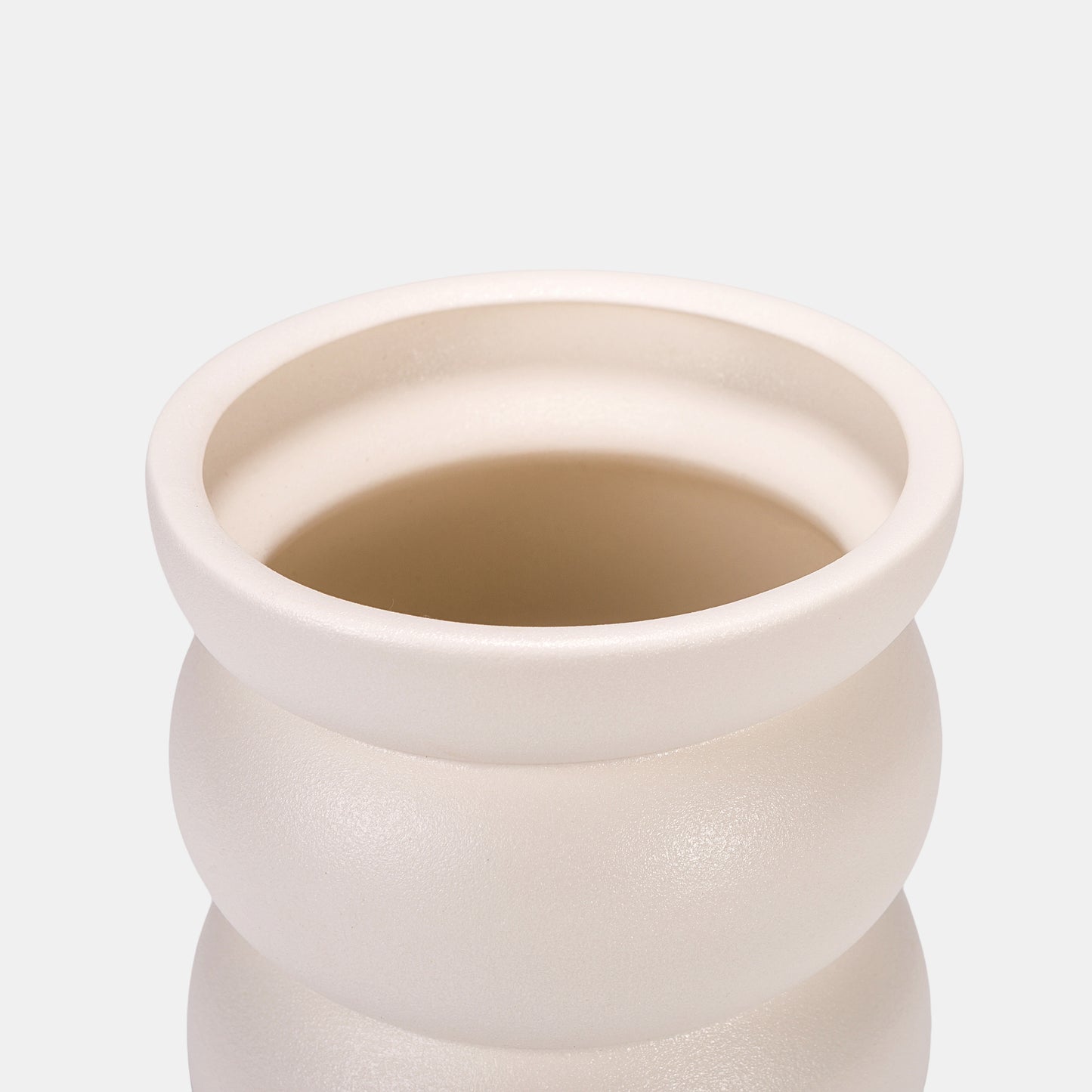 A prosperity-symbolizing white vase, shaped like sacred feminine silhouettes. Hold cascading roses in its nurturing curves or leave empty as a meditation piece. Matte ceramic surface glows warmly, contrasting beautifully with glossy bud vases. Versatile for dining table centerpieces or minimalist shelves. 