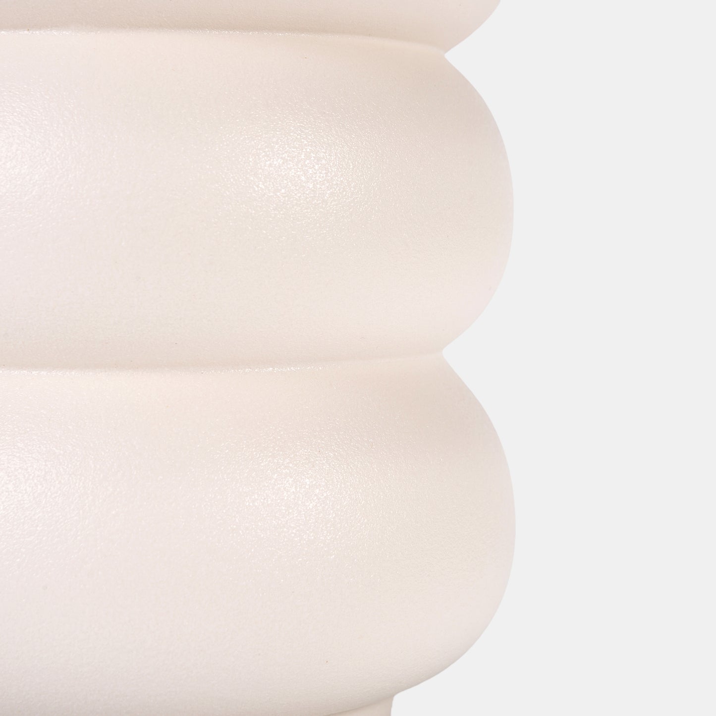 A handcrafted white ceramic vase celebrates life’s curves with biomorphic, feminine-inspired contours. Its matte white glaze mimics soft skin texture, glowing under sunlight. Perfect as a flower vase for roses or peonies, its belly-like form mirrors blooming petals. Pair with slim bud vases for yin-yang contrast on console tables. 